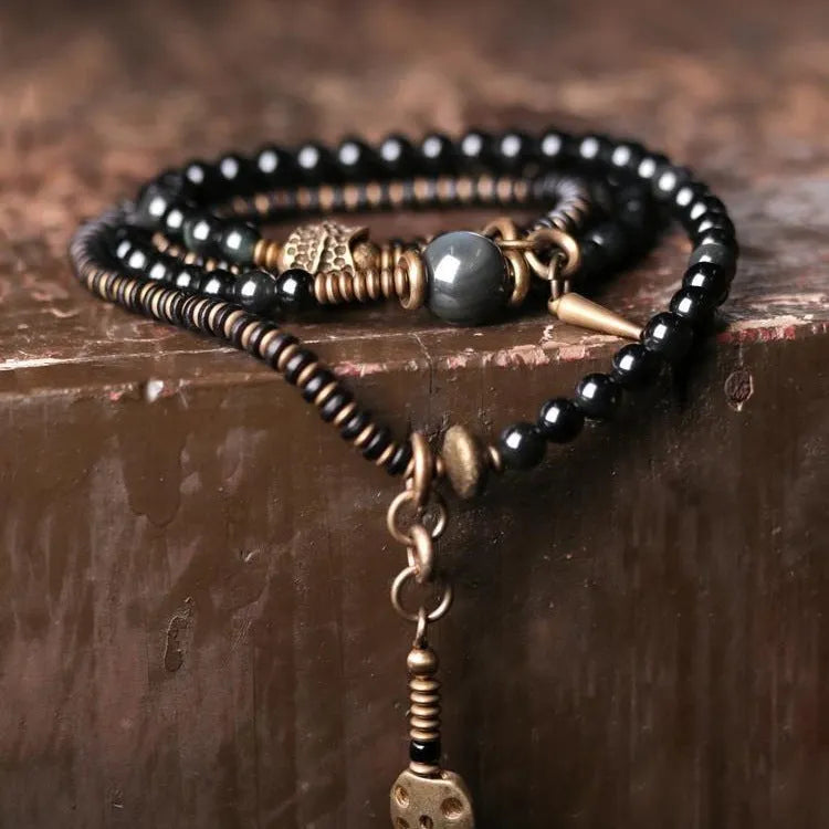 Black multi-layered bracelet with colourful geometric beads in retro design