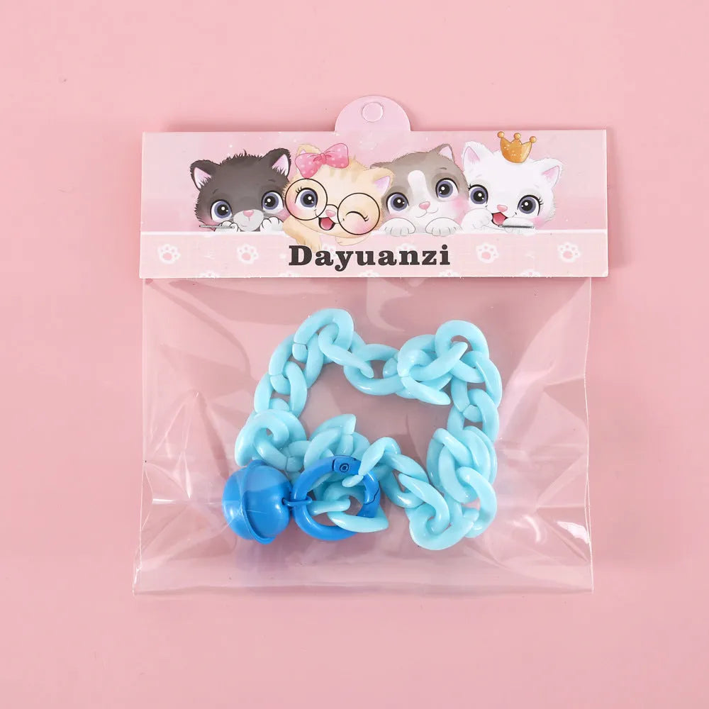 Adjustable plastic pet collar in macaron candy colours on a white background.