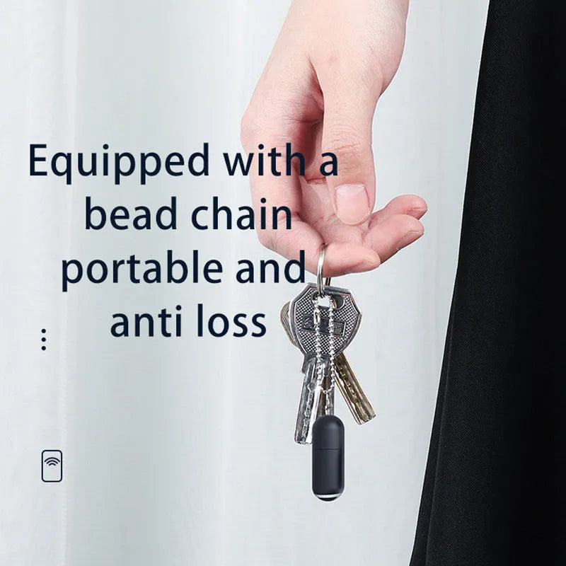 Small black capsule infrared remote emitter for smartphone Lightning, Type-C, and Micro-USB ports.