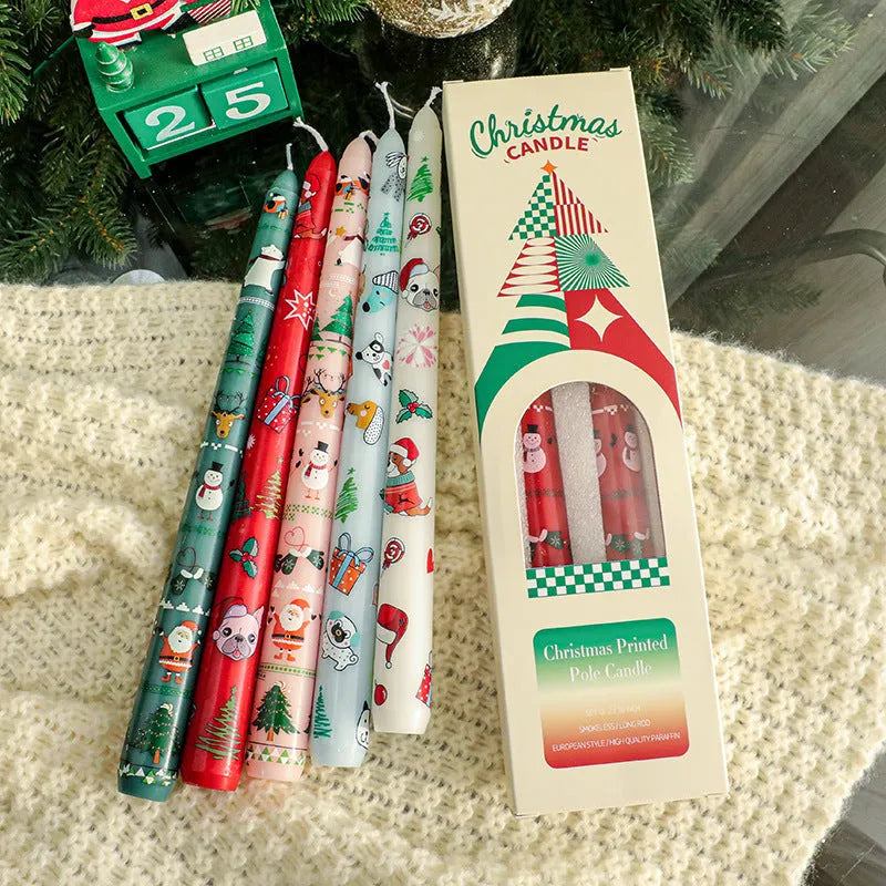 25cm Christmas pillar candle in paraffin, 2.2cm diameter, printed festive design, five colours available