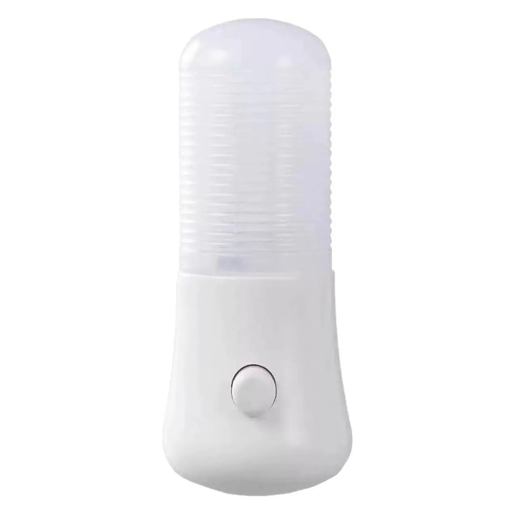 Compact square white minimalist plug-in bedside night light on a surface.