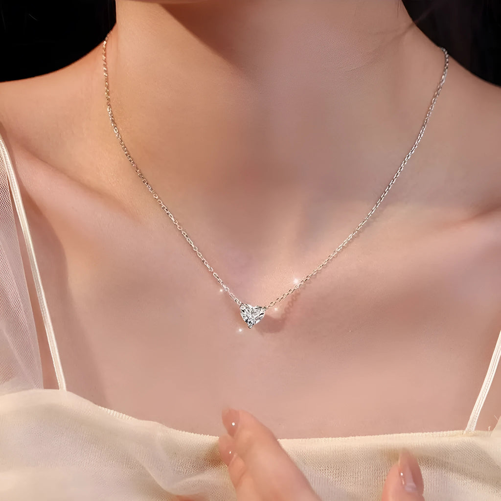 Silver-coloured women's heart necklace on a simple chain.