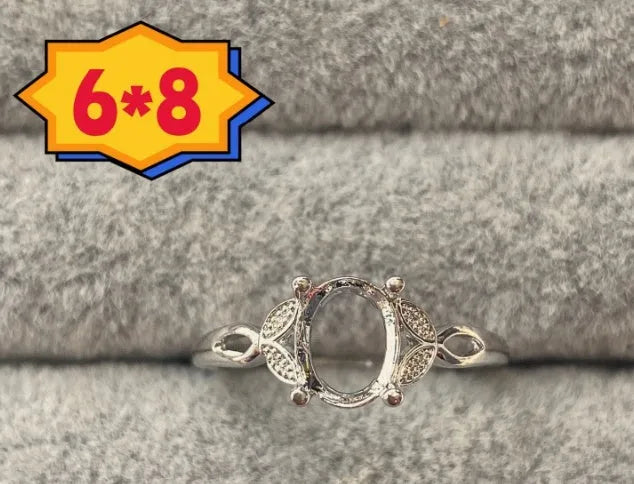 Oval denier ring with 6x8mm stone, open mouth design, and five-pointed star detail