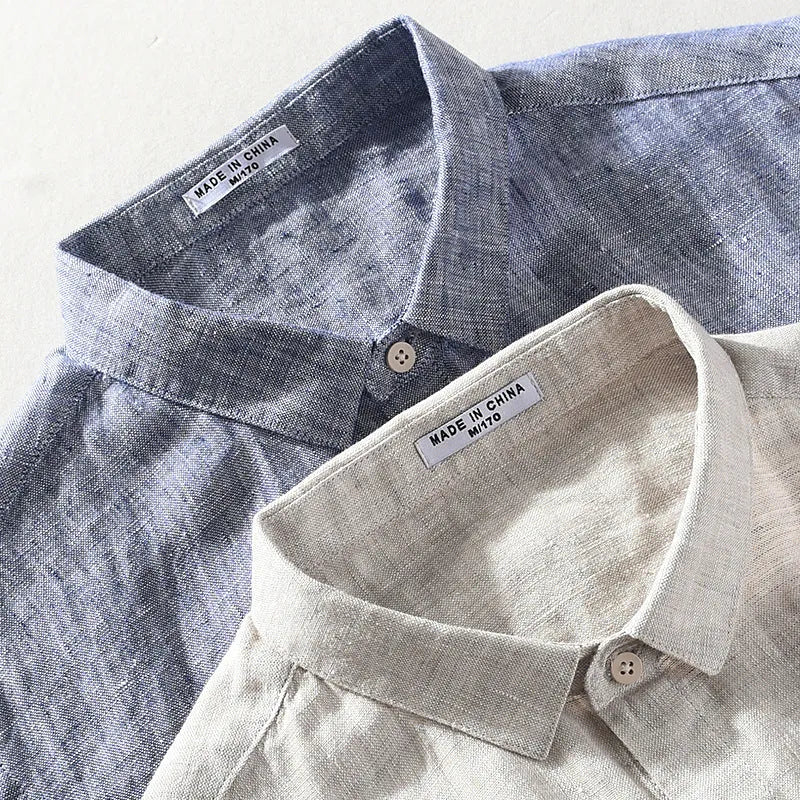 Men's light brown linen shirt with a square collar and short sleeves, shown on a hanger.