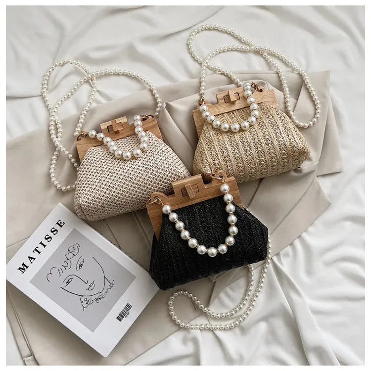 Women's soft straw woven horizontal square shoulder bag with pearl chain strap in beige colour.