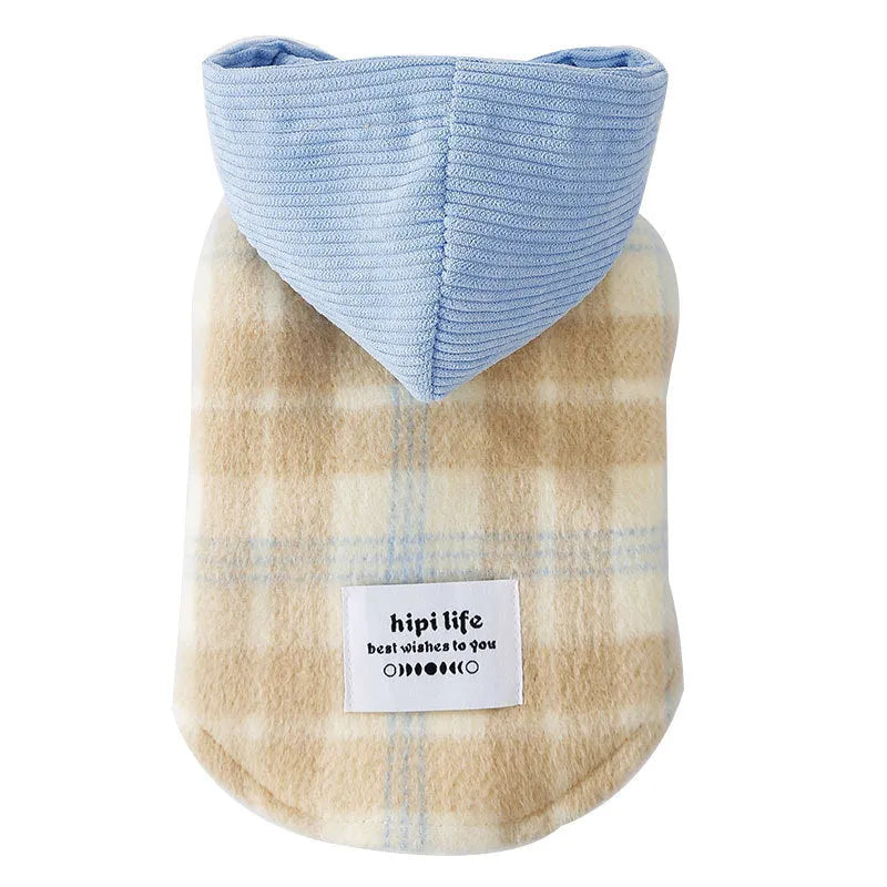 Blue corduroy dog vest with a chessboard grid pattern and an attached yellow hood.