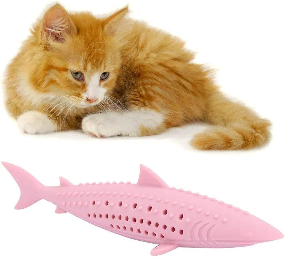 Green fish-shaped silicone chew toy for cats with visible side holes and a removable section for catnip.