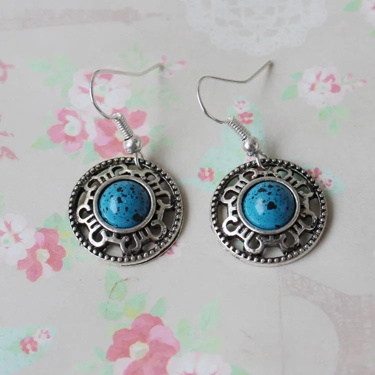 Ethnic Miao silver earrings with turquoise flower disk and geometric auspicious patterns