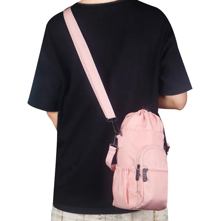 Canvas water bottle pouch with crossbody strap in black, green or pink colours