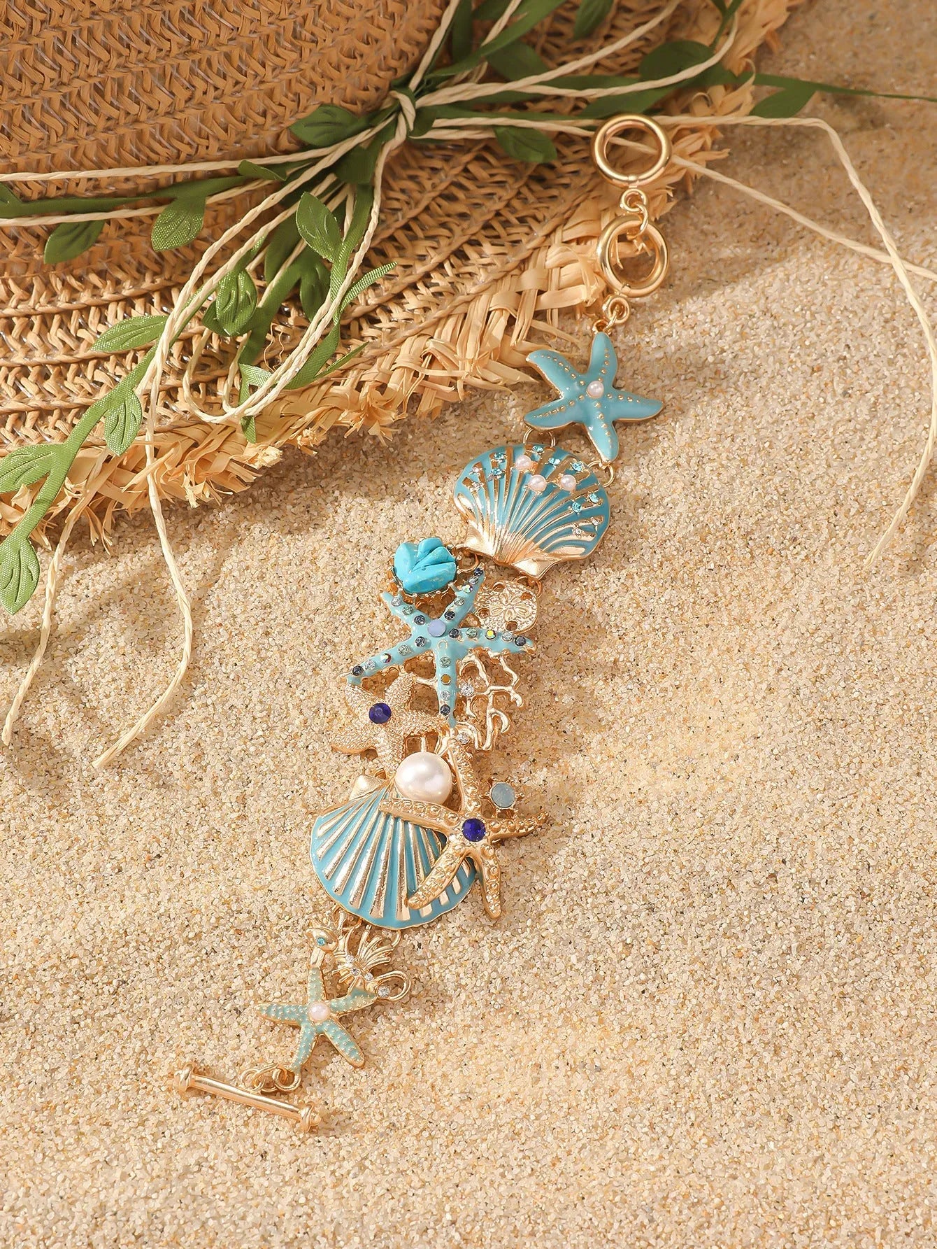 Women's alloy rhinestone marine shell and anchor bracelet with starfish charm in turquoise colour.