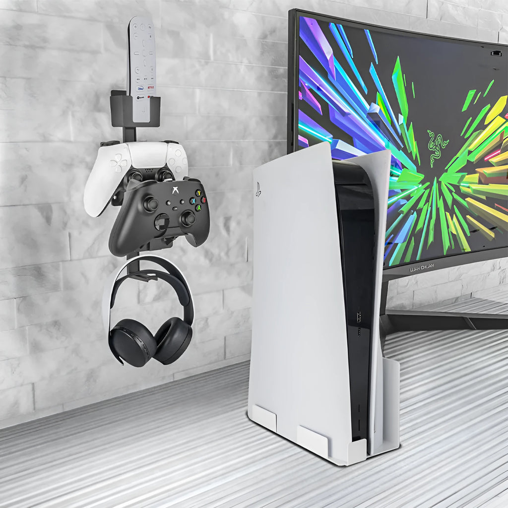 White wall-mounted plastic hook holding a PS5 controller and gaming headset.