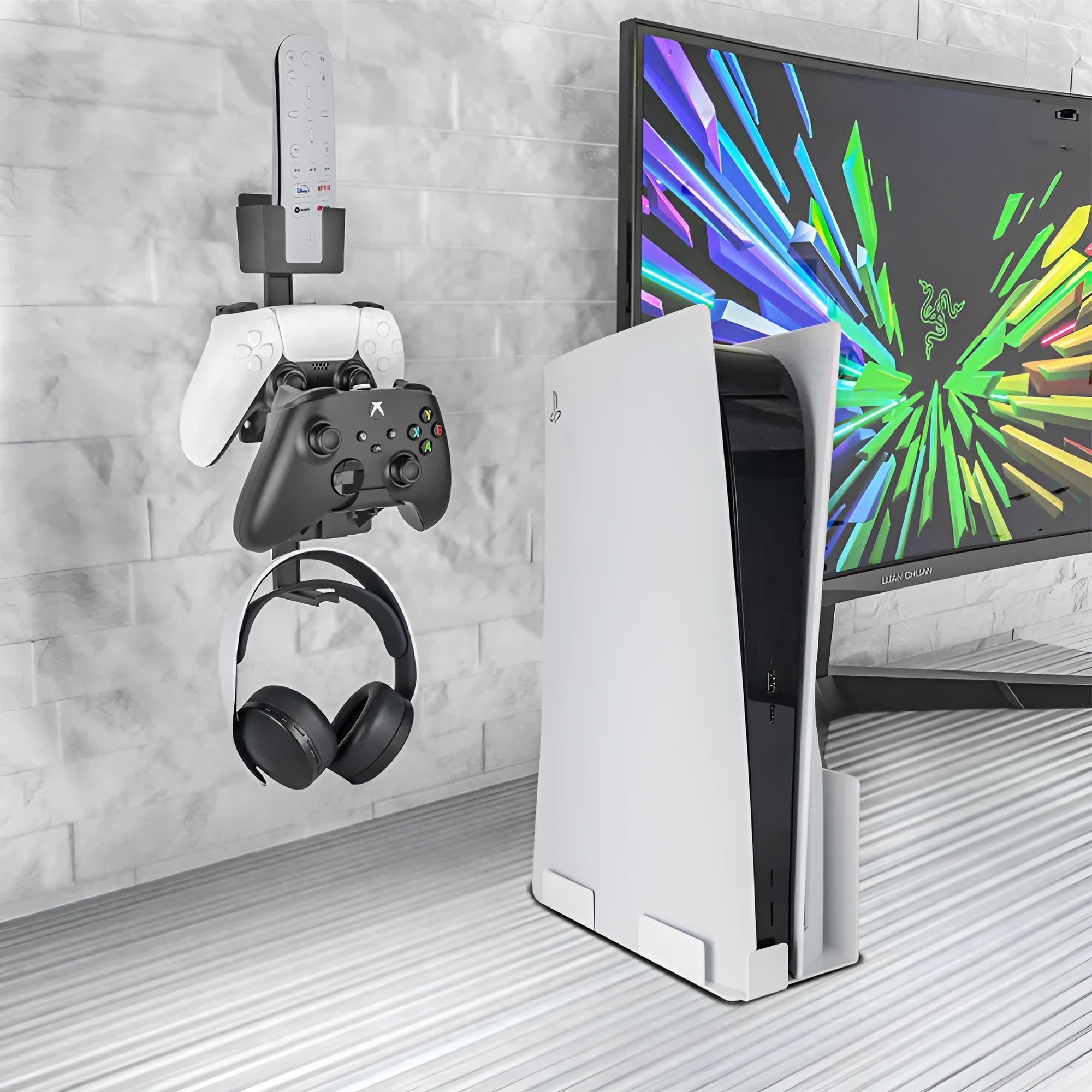 White wall-mounted plastic hook holding a PS5 controller and gaming headset.