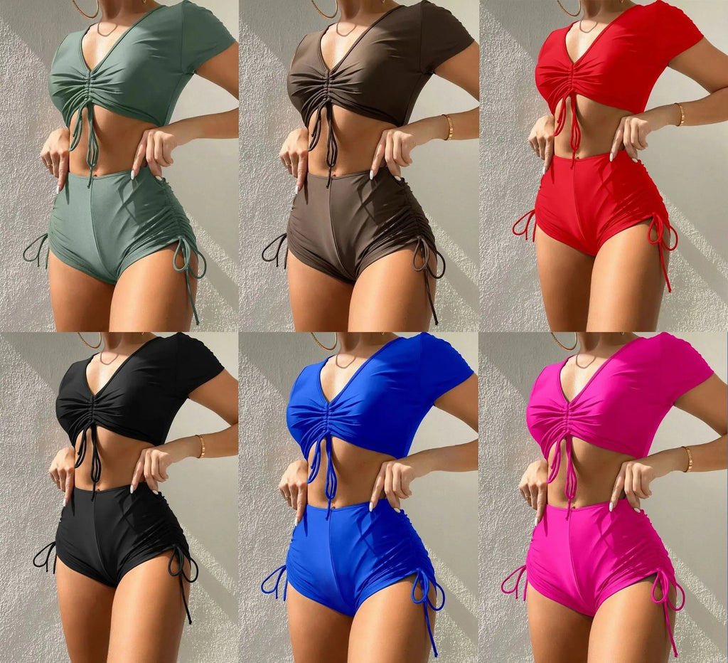 Women's dark green lace-up front swimsuit top with bow and matching shorts