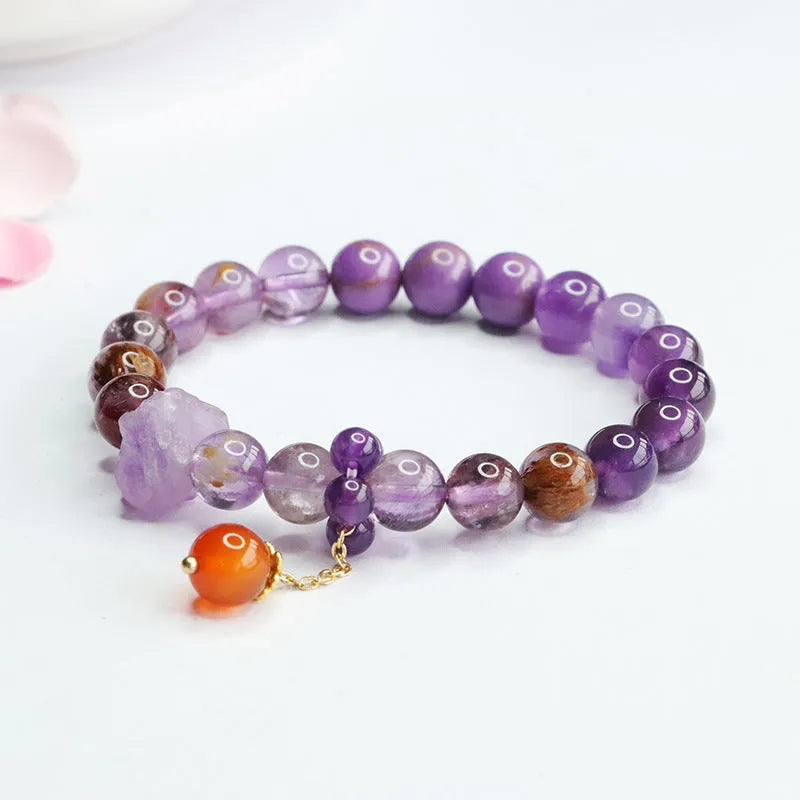 Natural nine purple crystal bracelet with amethyst beads and red agate stones in Mori style design