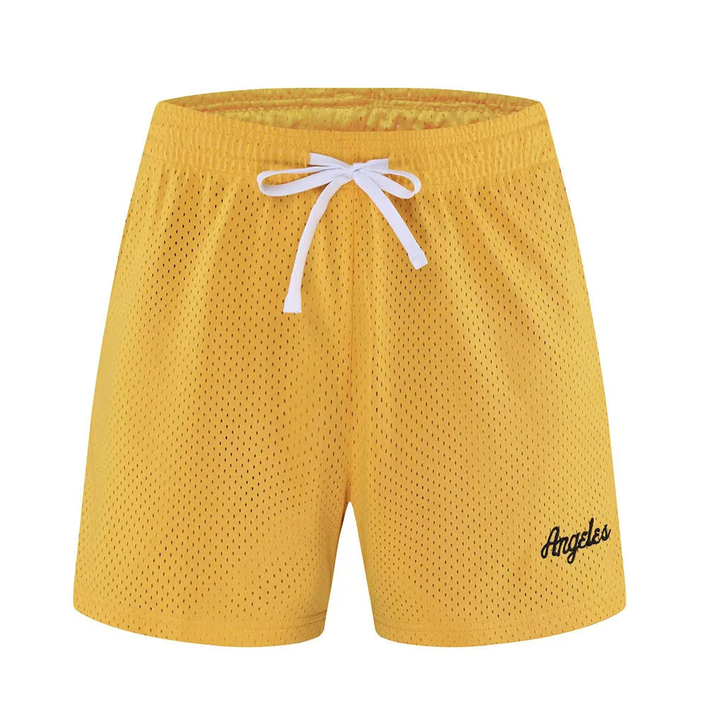 Men's black double-layer mesh sports shorts laid flat, showing mesh panel detail and shorts length.