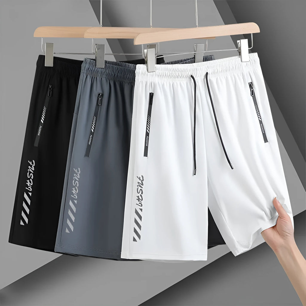 Men's quick-drying nylon sports shorts in black, loose fit with fifth pants length