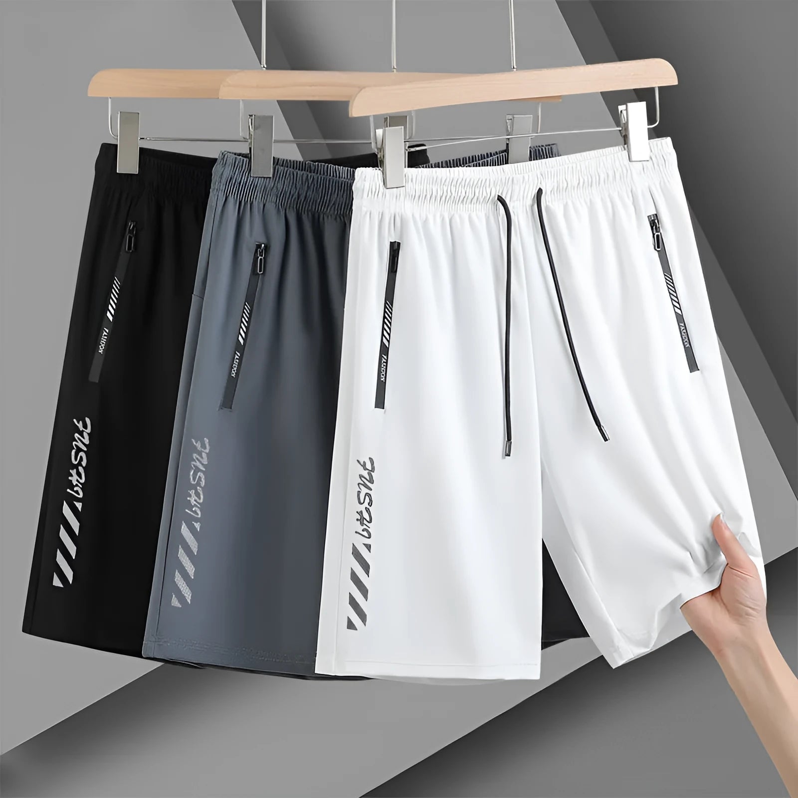 Men's quick-drying nylon sports shorts in black, loose fit with fifth pants length