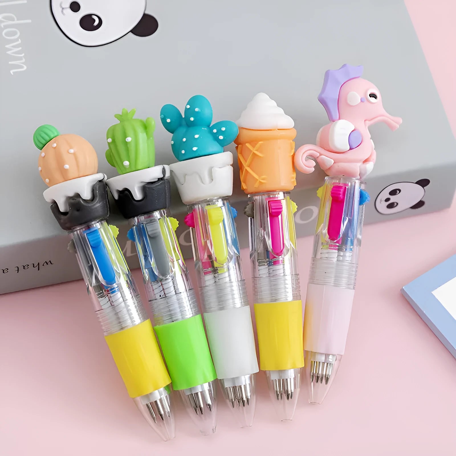 Four-colour press-action ballpoint pen with cartoon designs and 0.7mm bullet tip