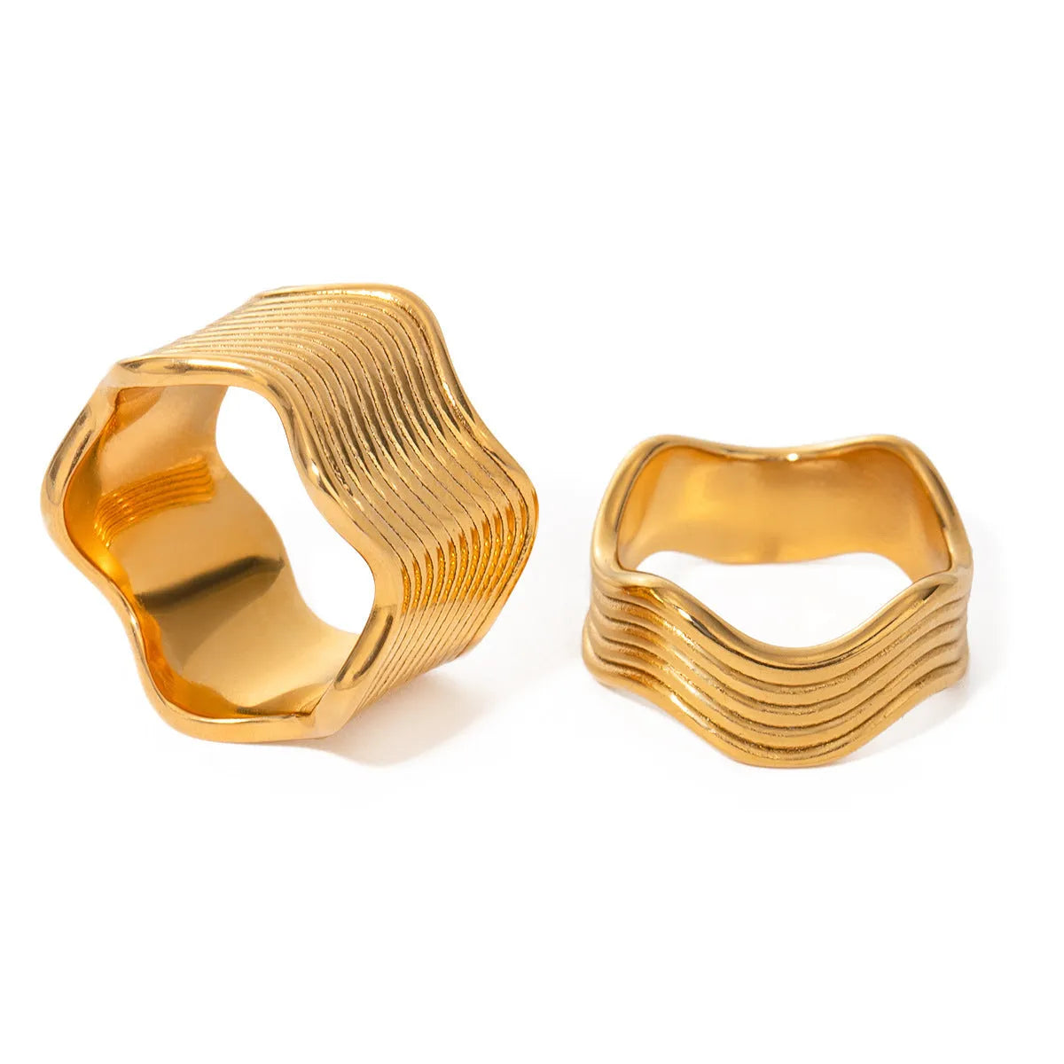 Stainless steel wide band ring with a geometric wave design in a Korean style.