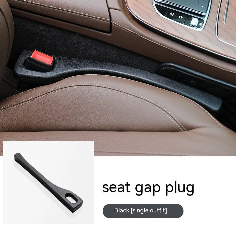 Black polyurethane car seat gap filler strip preventing items falling between vehicle seats