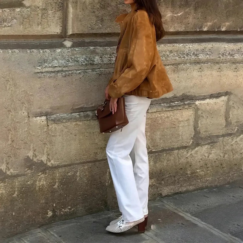 Retro loose fit solid colour polyester jacket with long sleeves on a model.