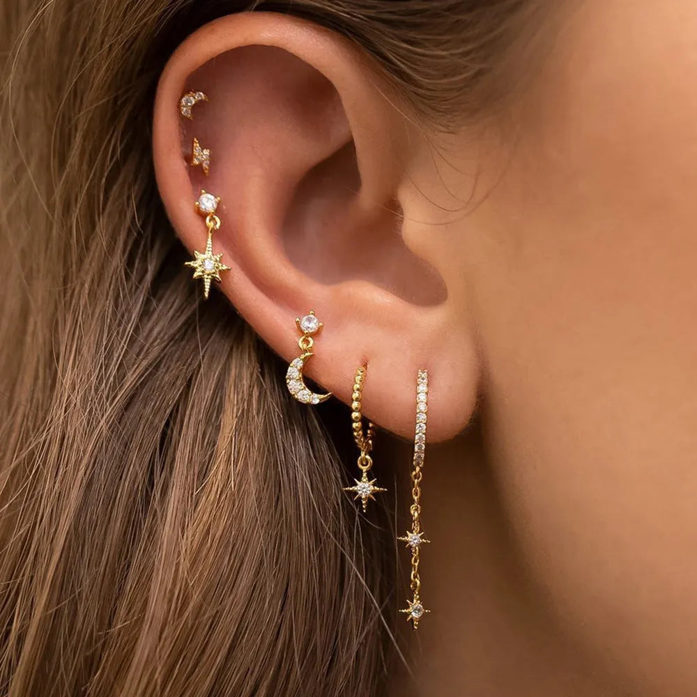 Set of six gold-coloured chain tassel earrings with zircon studs for women.
