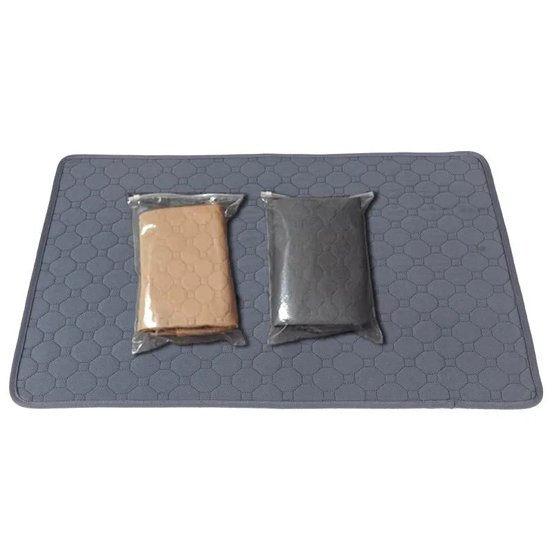 Grey and khaki washable waterproof dog pee pads on a wooden floor.