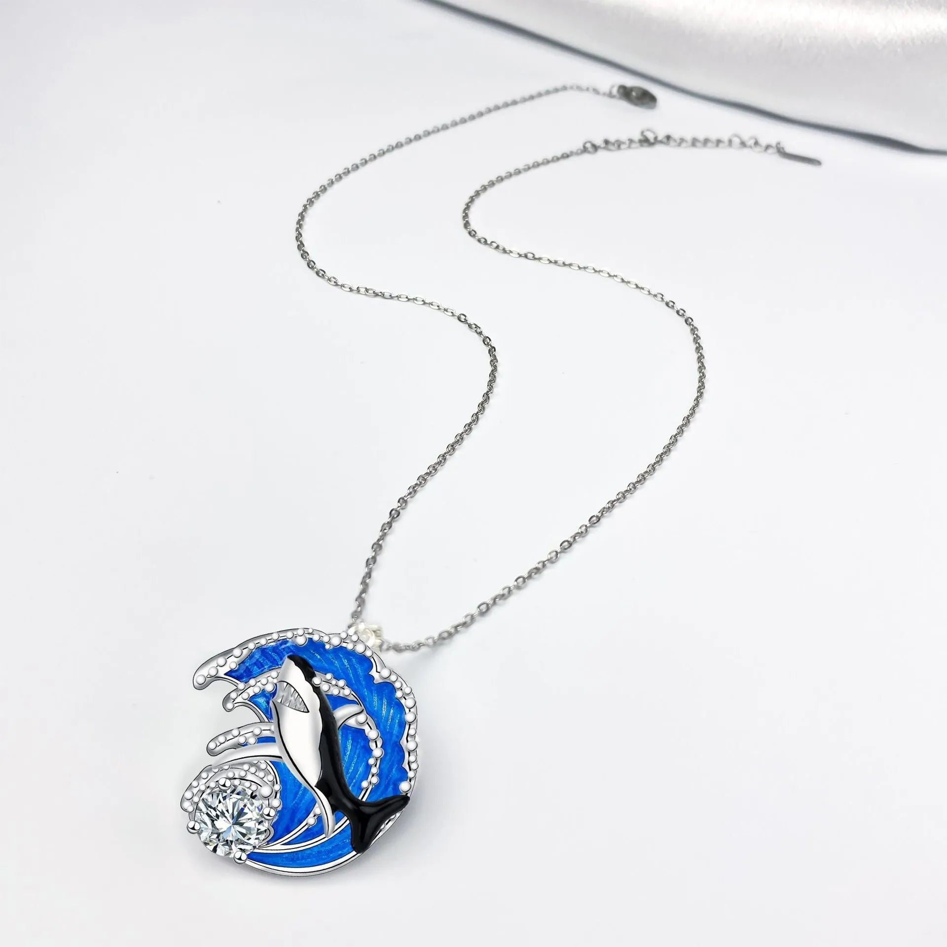 HAILANG women's silver-tone shark pendant necklace on a cross chain, adjustable length.