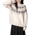 Women's milky white Fair Isle patterned pullover sweater with geometric design and crew neck.