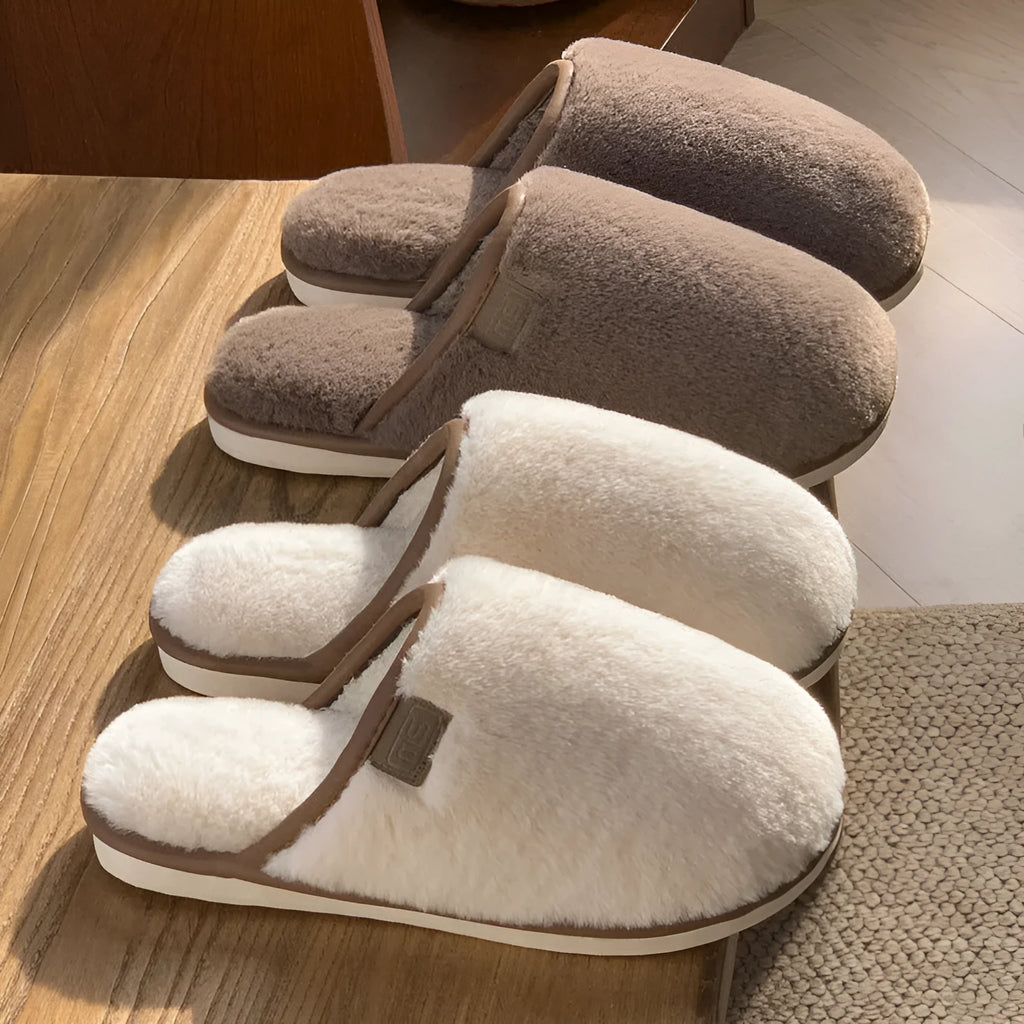 Solid-colour winter plush slippers with non-slip PVC sole on a home floor