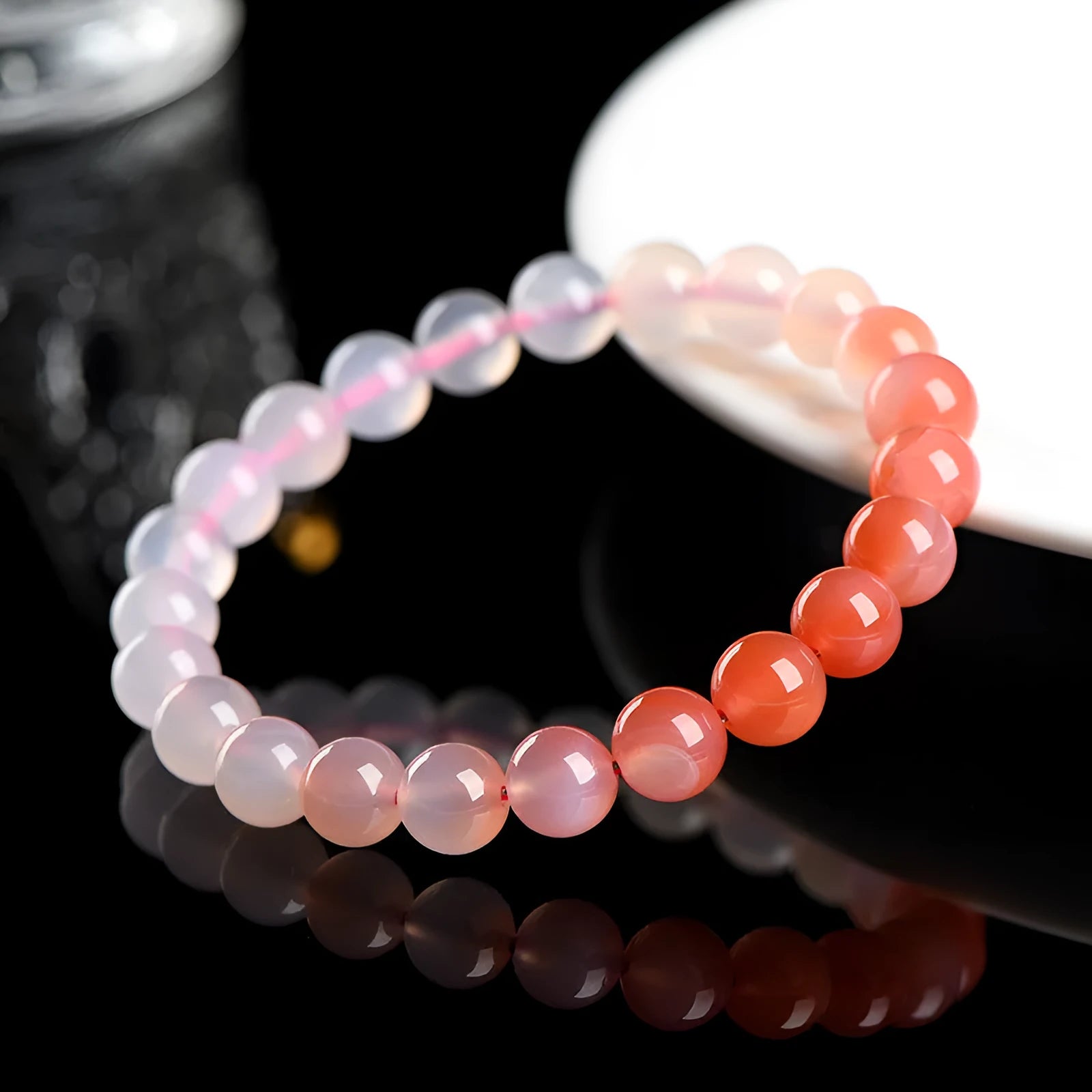 Natural gradient Yanyuan agate bracelet showing colour variation on geometric beads in single circle design