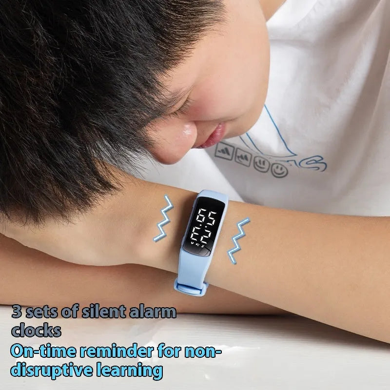 Vibration alarm smartwatch with LED display on a silicone strap, shown in a colour option.