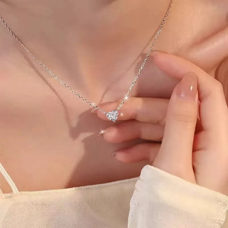 Silver-coloured women's heart necklace on a simple chain.
