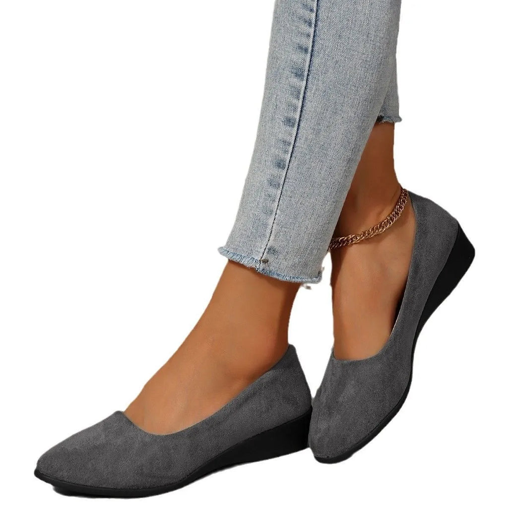 Women's suede wedge pumps in light brown with pointed toe and shallow mouth design.
