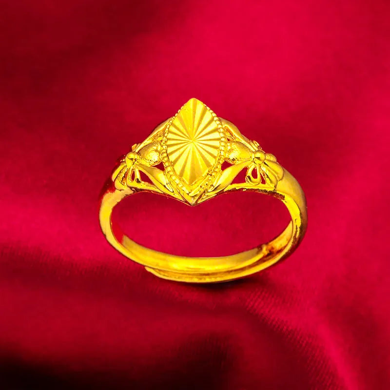 Gold-coloured geometric brass ring with textured design elements for women