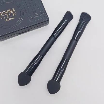 Elegant black double-headed concealer brush with miter sponge and synthetic bristles on a wooden handle.