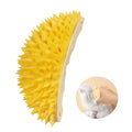 Yellow durian-shaped cat corner scratcher with massage brush installed on wall