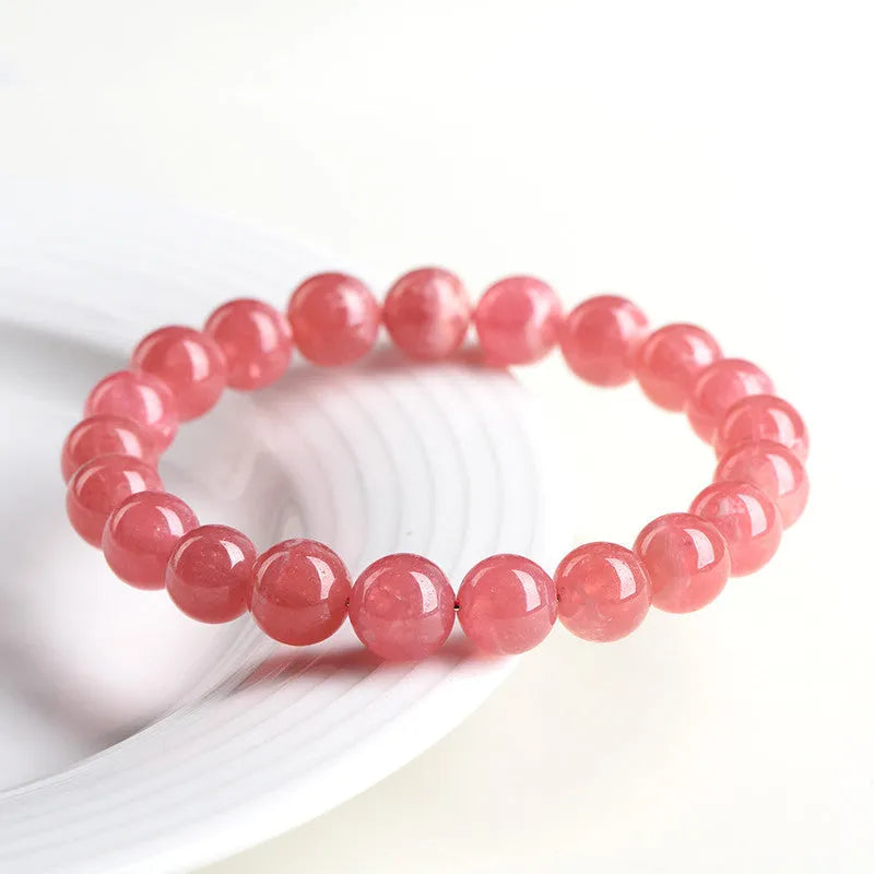 Women's geometric crystal bracelet with Longevity Lock in natural red rhodochrosite stone.