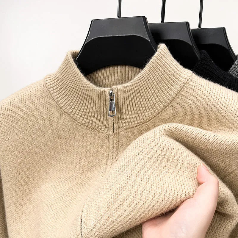 Men's black high collar zip-up knitted cardigan on a hanger, loose fit.