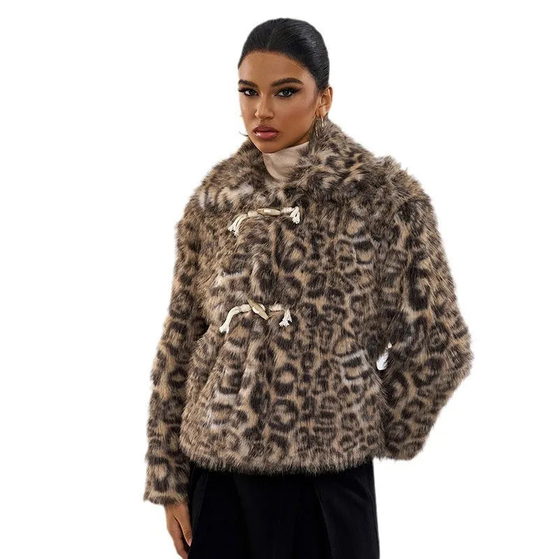 Female leopard print coat with a silver buckle detail on the lapel.