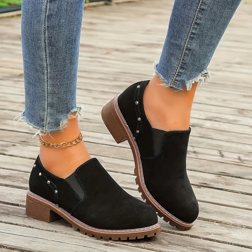 Women's light brown suede ankle boots with elastic band and thick low heel on rubber sole