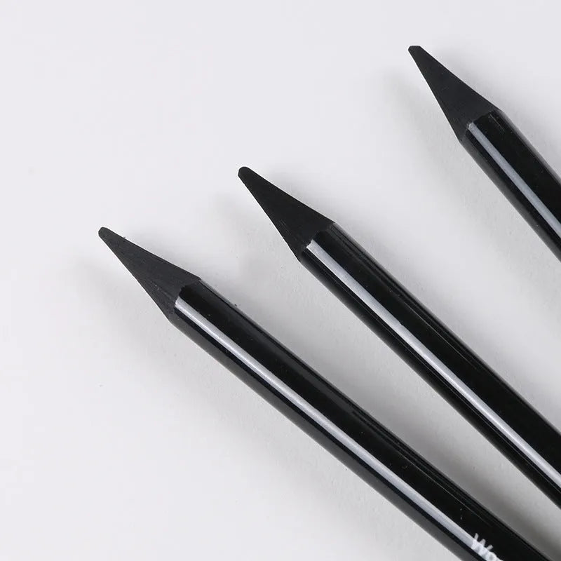 Graphite and carbonized wooden drawing pencils with solid lead cores on suction card packaging