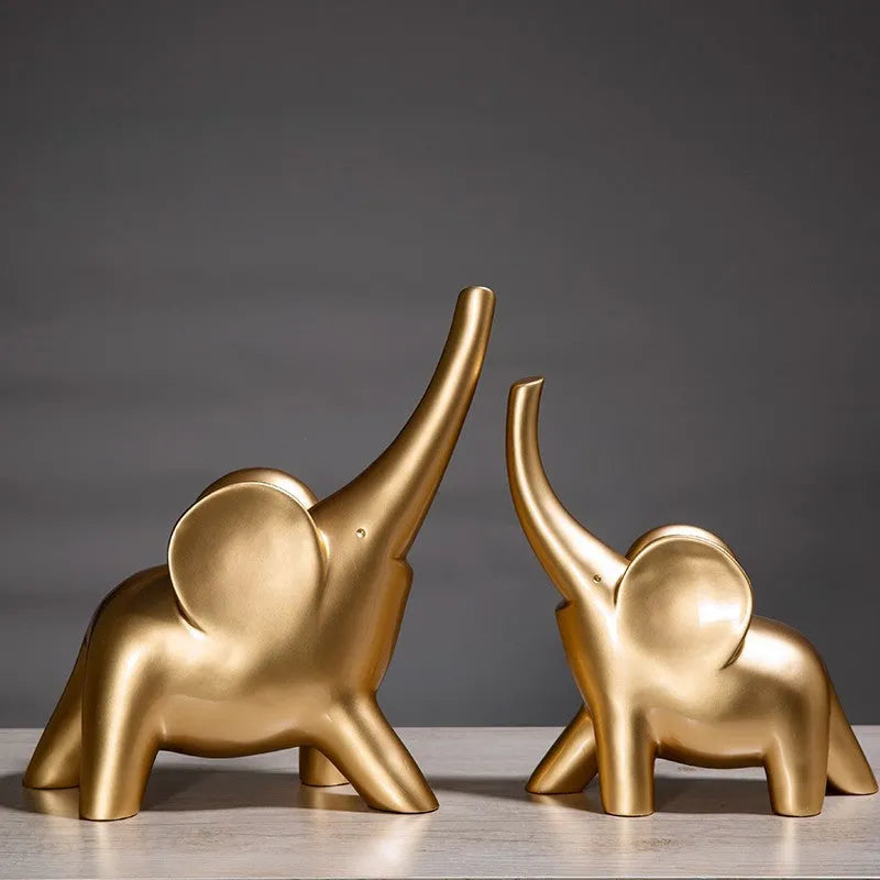 Rose gold and white resin elephant ornaments in large and small sizes displayed singly and as pairs