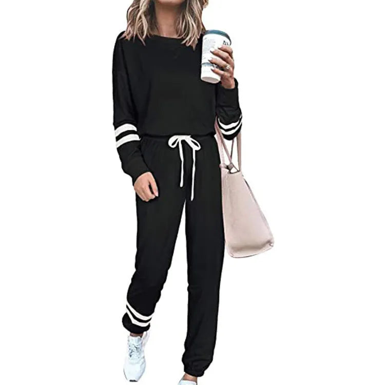Women's plus size loose-fitting casual suit set in a solid colour, showing the long-sleeve top and matching trousers.