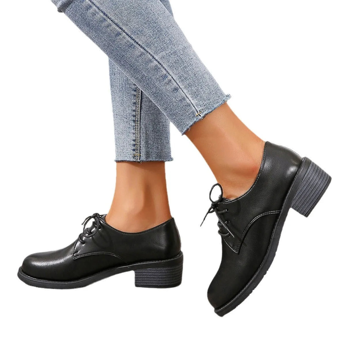 Black women's low-top work shoes with a thick chunky heel and round toe.