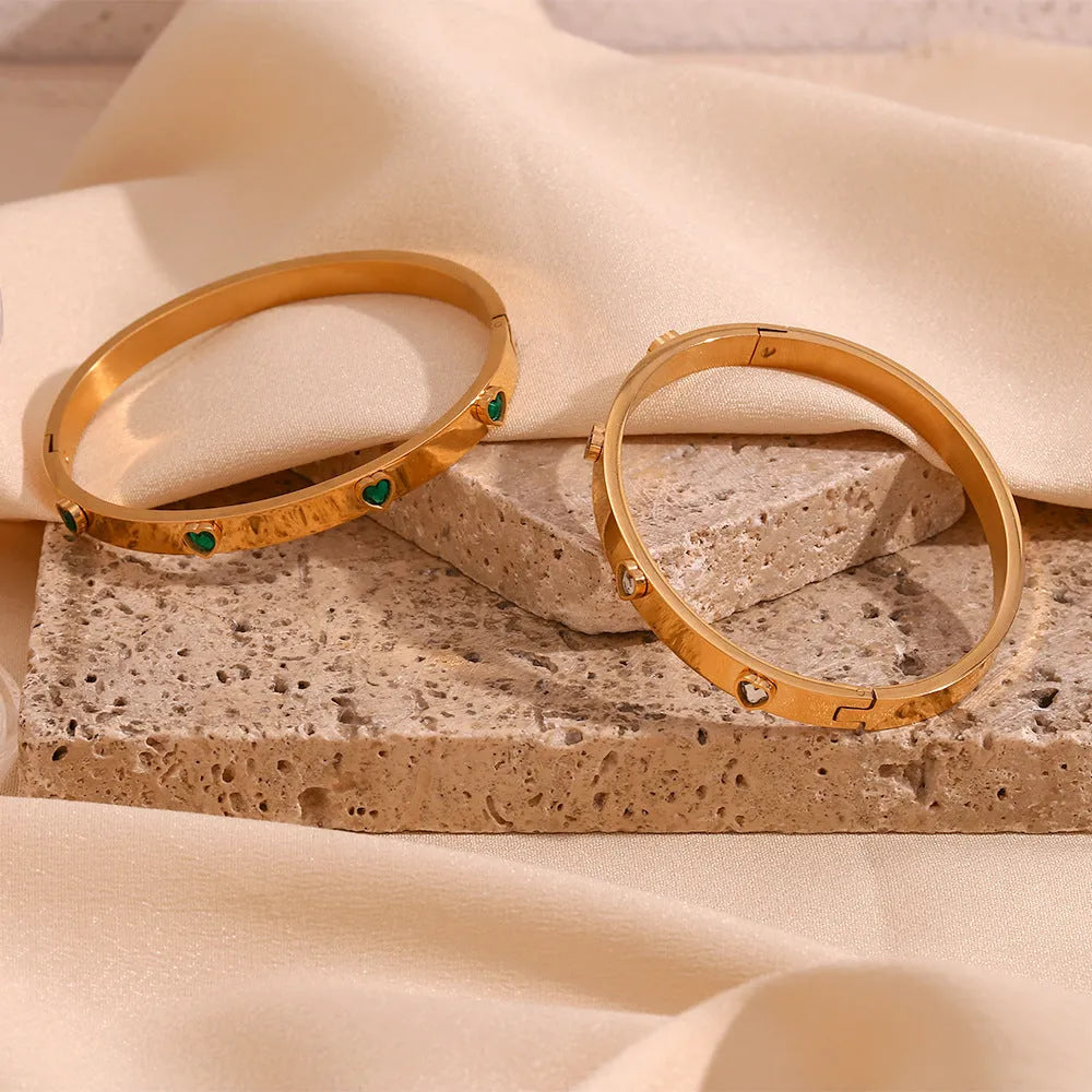 Stainless steel women's bracelet with peach heart design and micro-inlaid detailing in electroplated golden colour