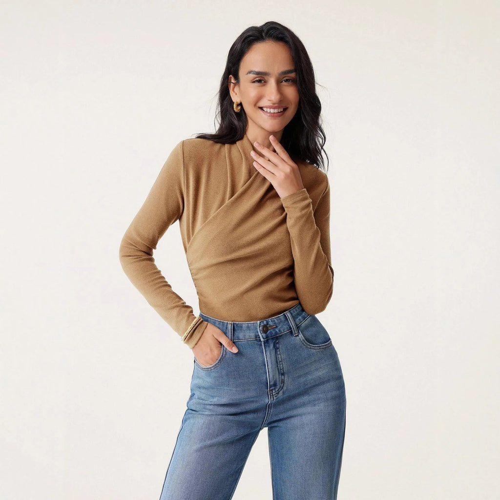 Camel-coloured slim-fit women's pullover sweater on a hanger.
