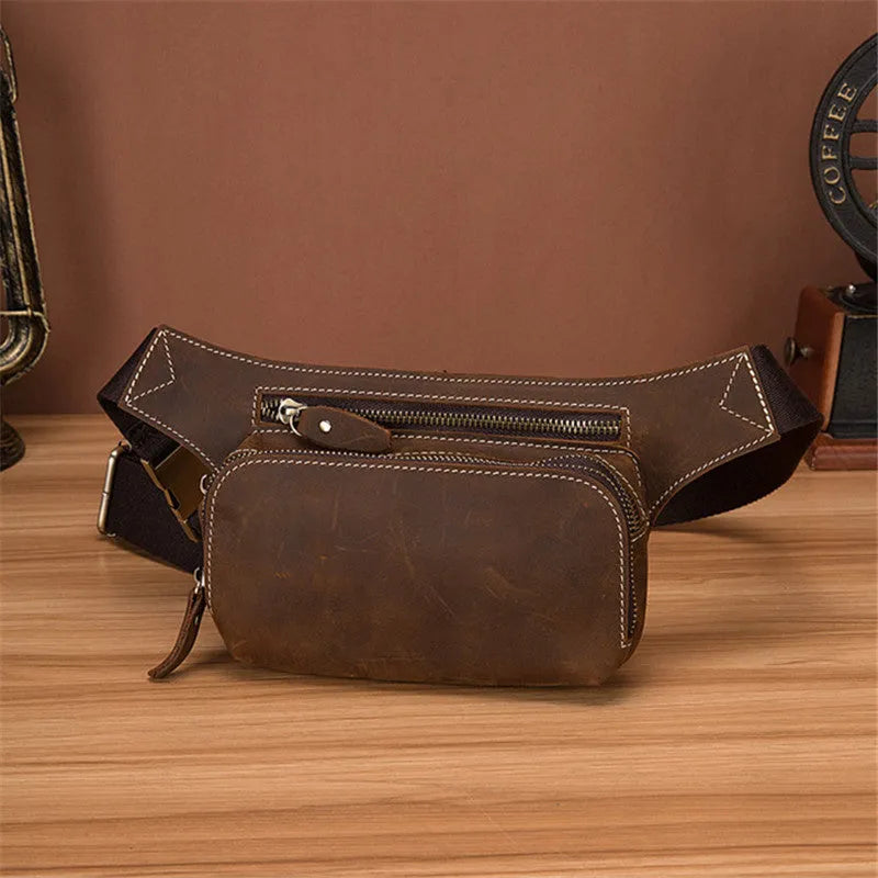 Brown top layer cowhide men's sports waist bag with pull closure, showing size and interior phone pocket.