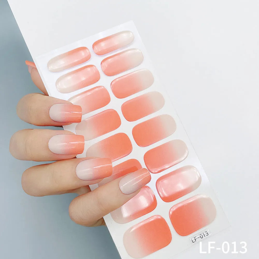 Full coverage nail art stickers sheet with 16 designs including cross, rose, tulip, and cartoon patterns.