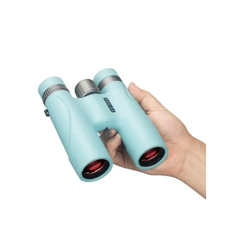 Compact blue or grey 10x32 binoculars with wine red film lenses on a plain background.